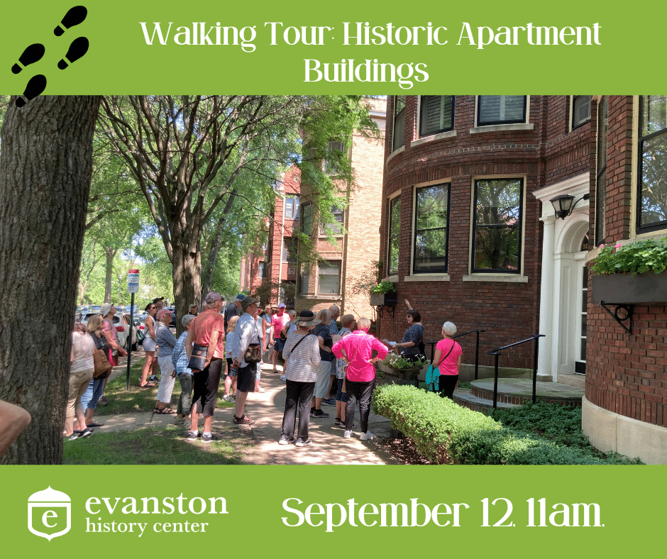 20 people looking up at a historic brick apartment building